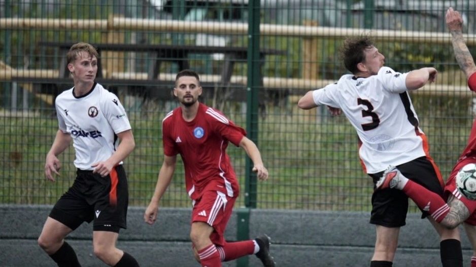 Whiteley defending during the home match against Andover Town